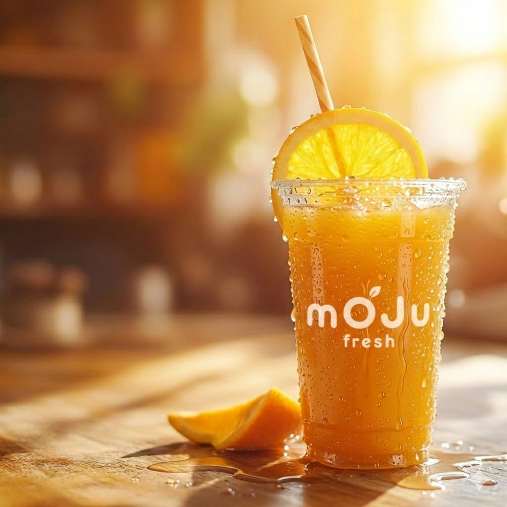 Cup of fresh orange juice, part of a simple morning routine